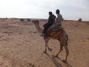 Aaron and a desert guide on a camel
