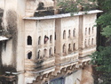 Aaron sticking his head out of a old fortress window
