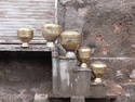 Brass pots drying  on stairs