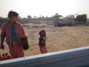 Burmese gas station attendant and her son