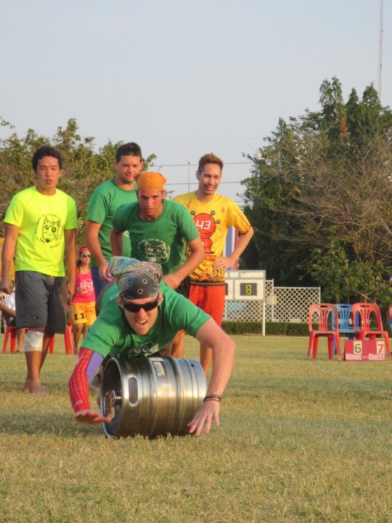 Teammate Chris diving over a keg with me close behind