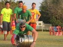 Chris diving over a keg