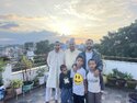 The family on the roof at sunset