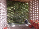 Man hanging grapes to be dried