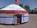 Me and tom sticking our heads out of a yurt