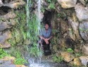 Me behind waterfall in bonsai garden