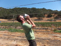 Me drinking blueberries from a pale
