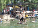 Me passing a shirtless chinese kid on rope bridge