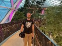 Me under the Orchard's glass dome during our layover in Doha