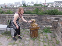Moriah feeding adorable trash can