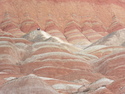 People in the distance at the danxia landforms