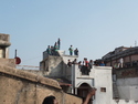 Roof of wild young men flying kites