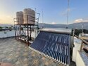 The solar water heater and water tanks on the roof