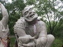 Statue getting his ear licked by a fish