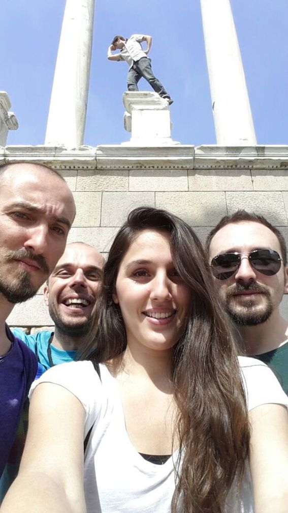 My Izmir friends at Pergamon with me posing as a statue in the background