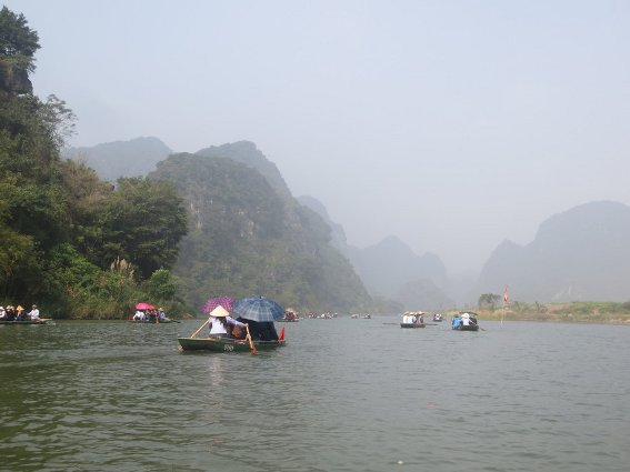 A fleet of tour boats at Trang An