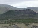 Volcano near white lake
