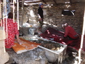Women washing carpets in hot spring