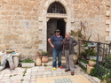 Yoels parents in front of their house